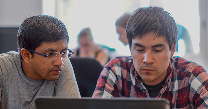 Image of 2 students doing HPC work together